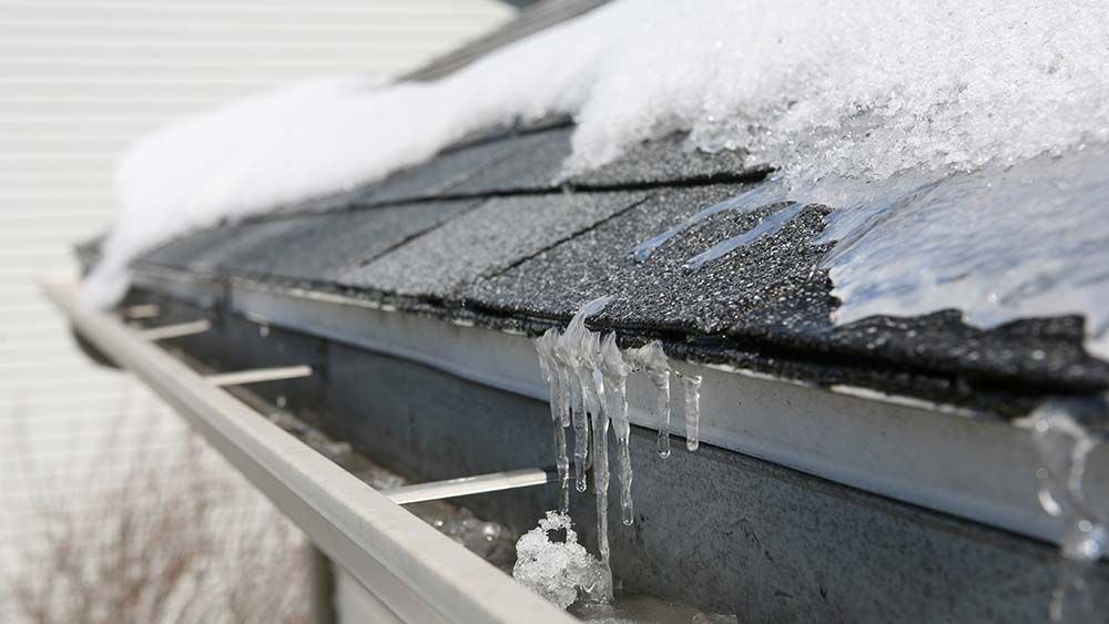 Roof with ice on it during winter