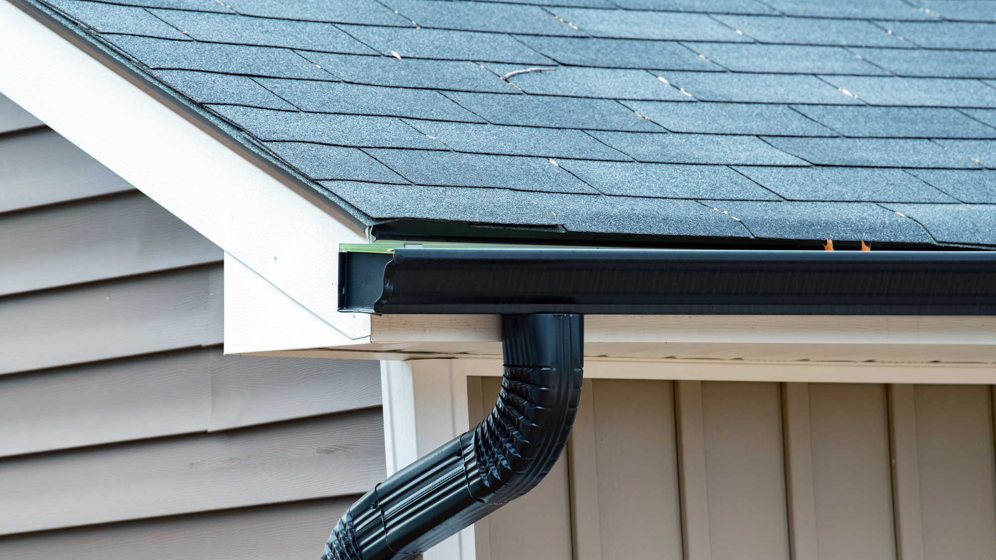 home-with-gutter Home with gutter | KTM Roofing