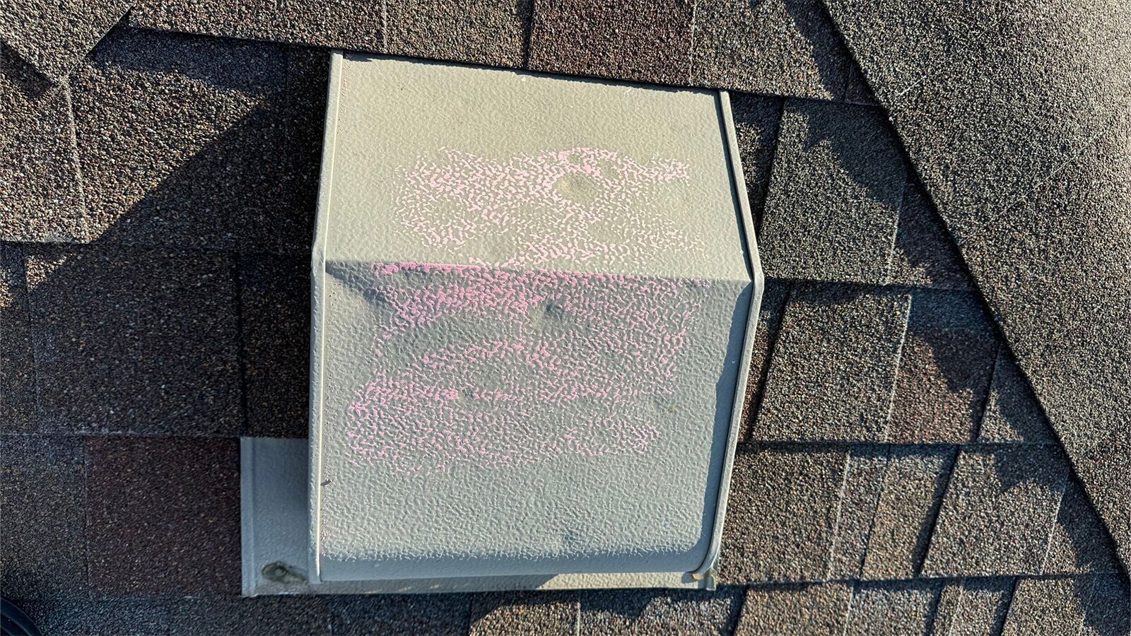 Residential roof vent damaged by hail in a Atlanta suburb.