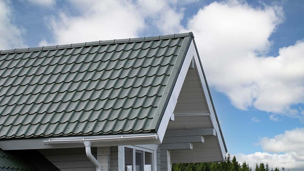 Metal shingle tiles with exposed fasteners in Atlanta, GA.