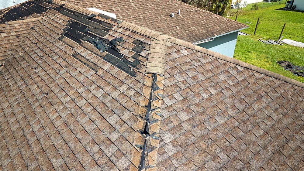 house missing shingles and needs a replacement