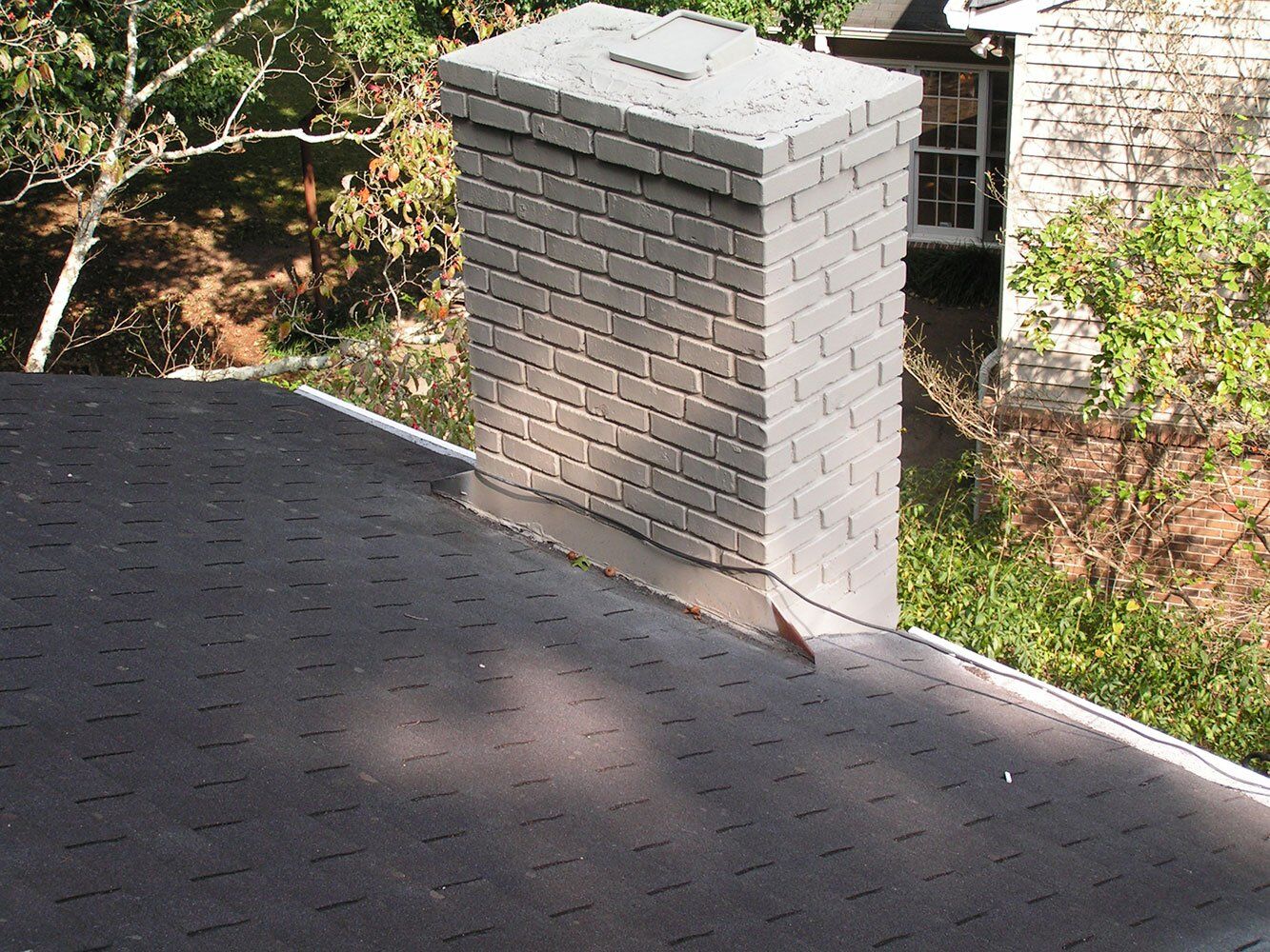 Chimney flashing damaged on a home in North Atlanta.