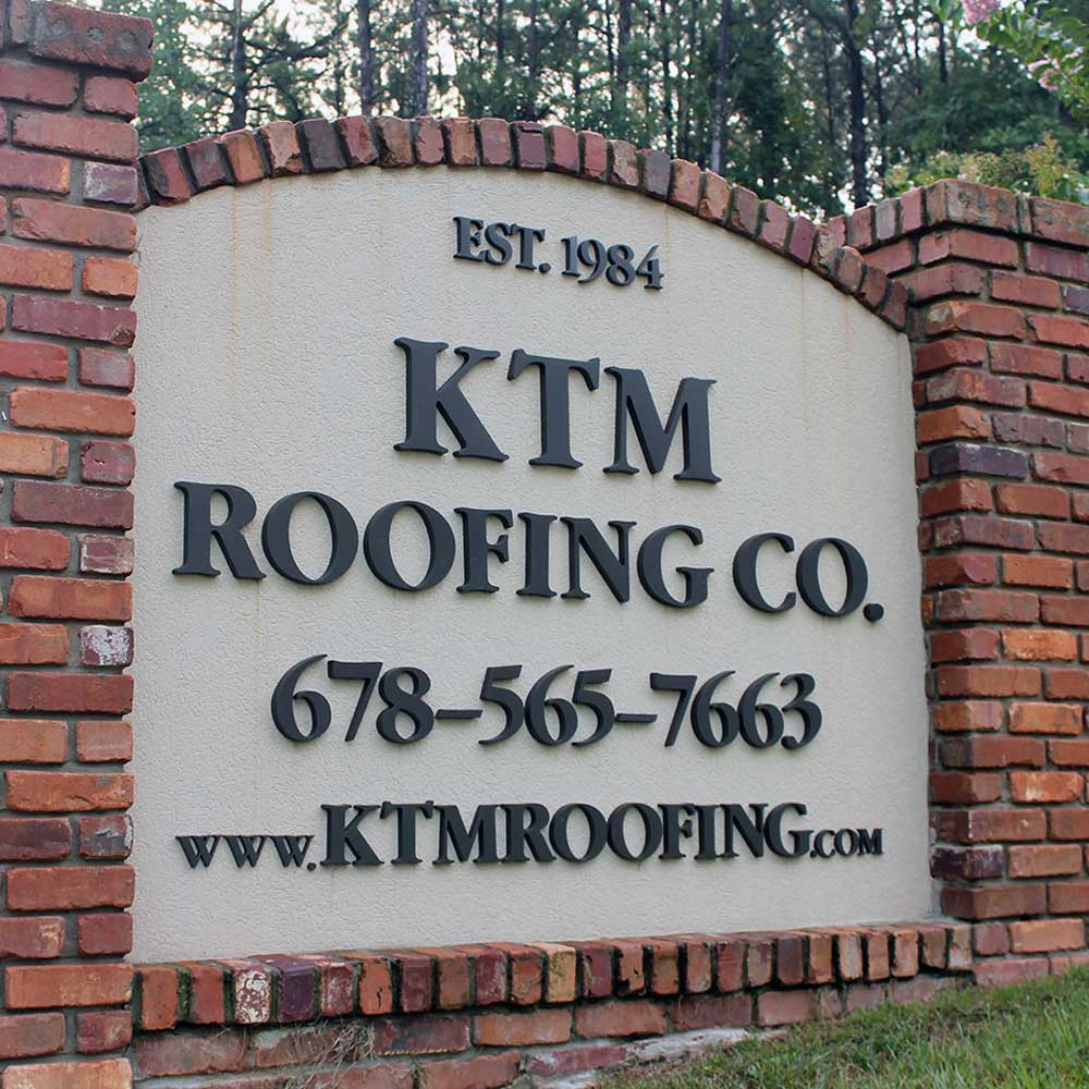 KTM Roofing brick sign