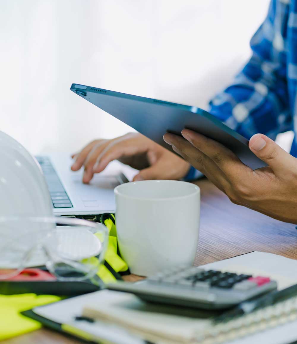 Worker preparing roofing estimate | KTM Roofing