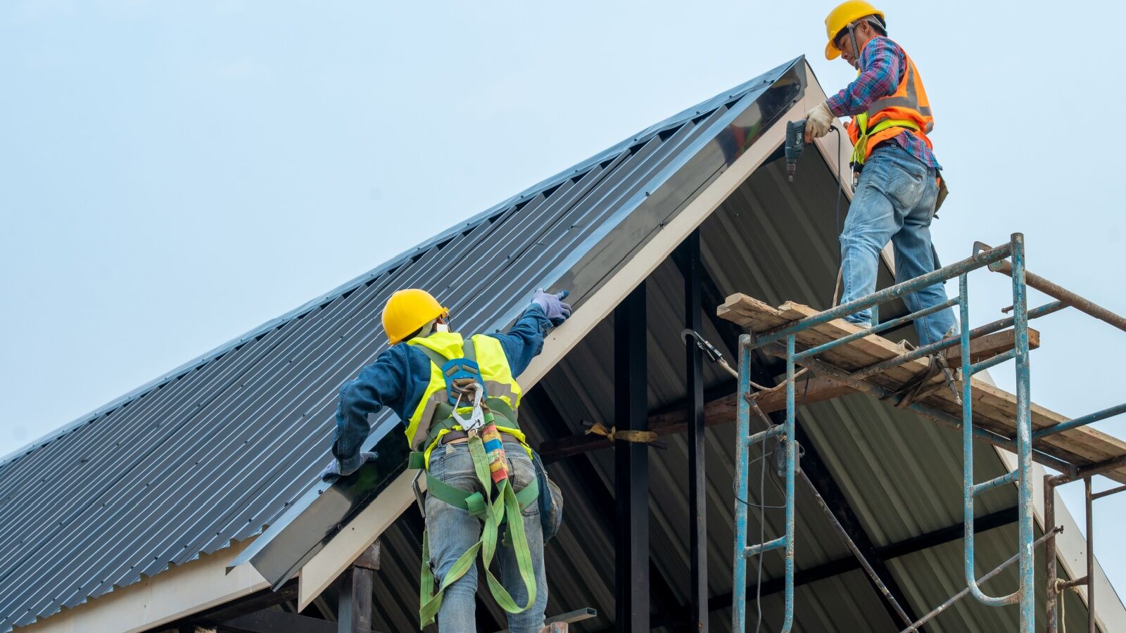 KTM Roofing workers installing a metal roof in Atlanta, GA.