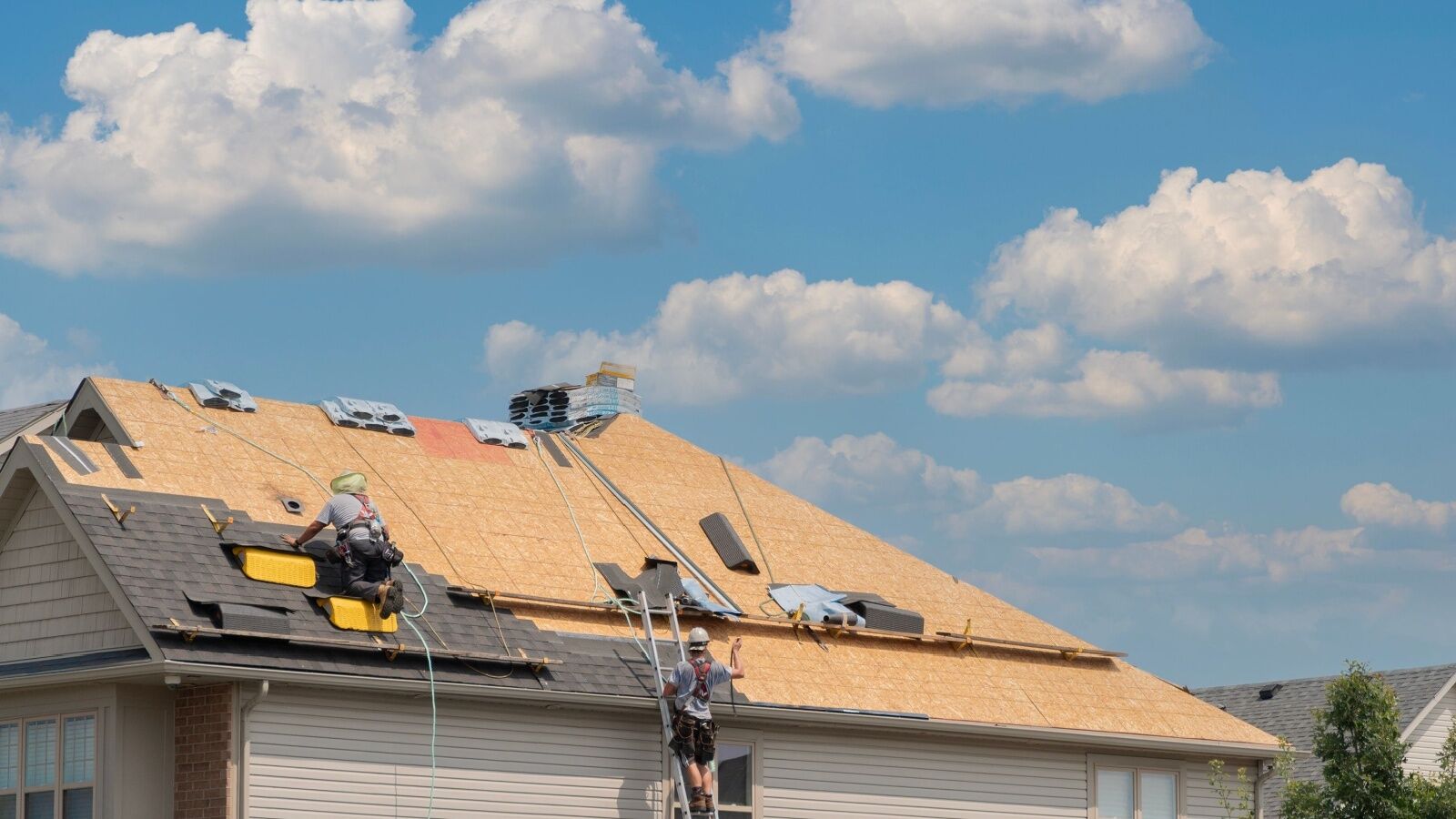 average-roof-replacement Residential home in Atlanta, GA getting a roof replacement from KTM Roofing.