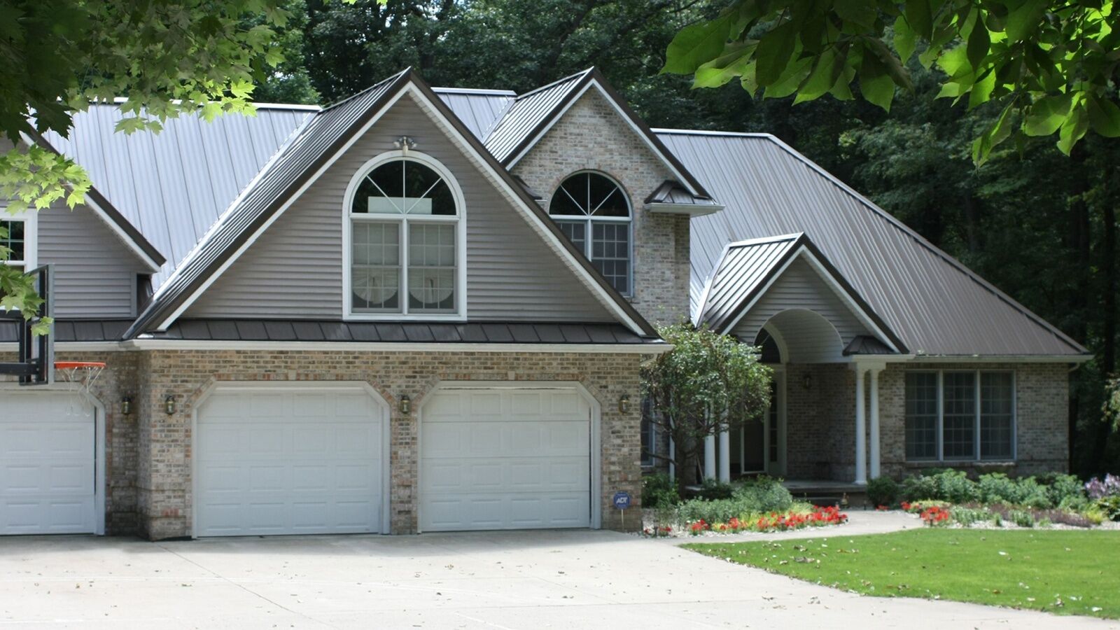 Atlanta suburban home with metal roofing by KTM Roofing.