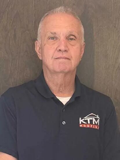 Doug Russell's KTM roofing headshot.