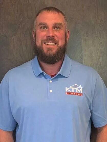 James Egan's KTM roofing headshot.