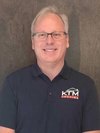 Richard McLoughlan's KTM roofing headshot.