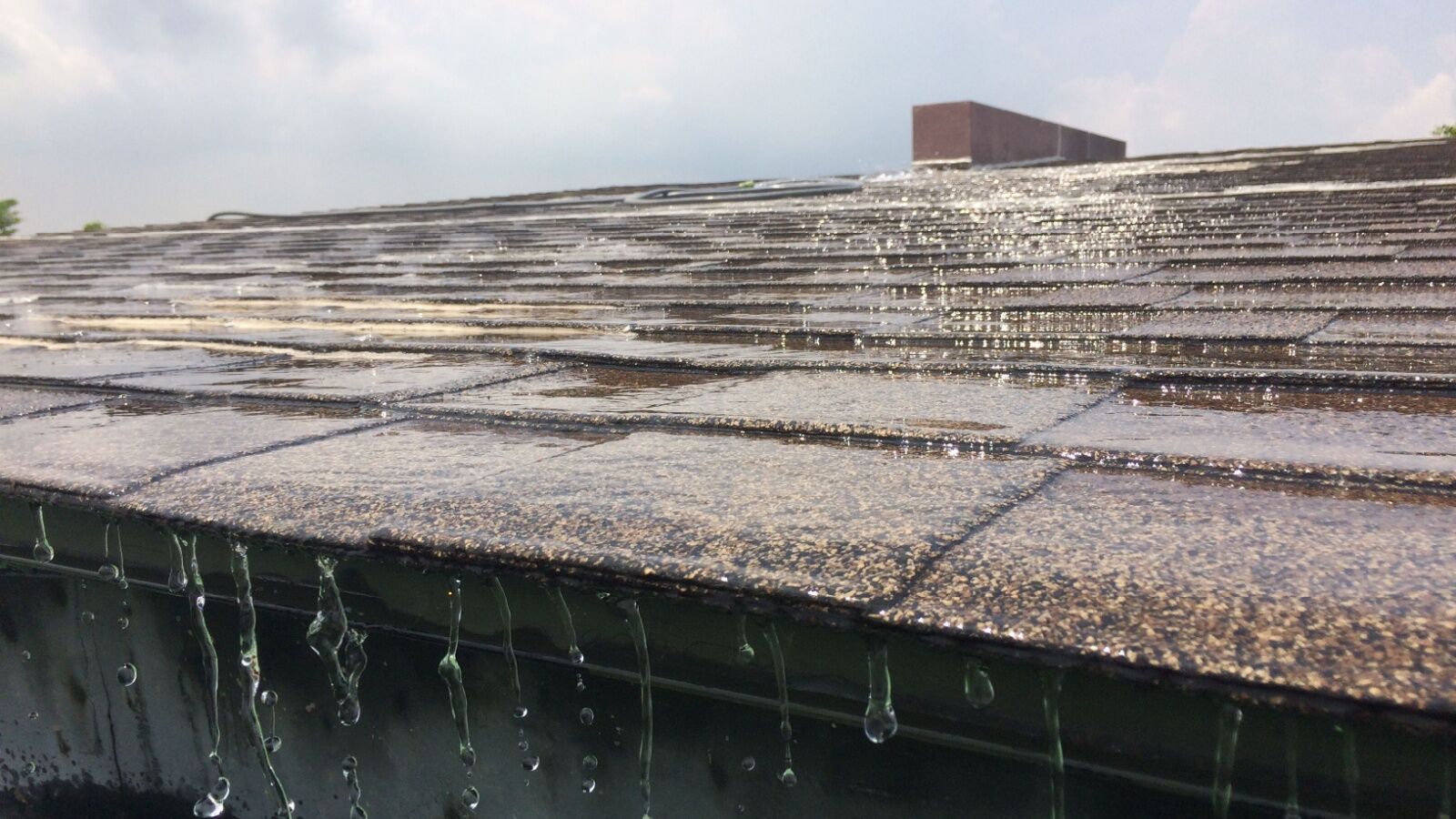 Asphalt roof enduring a rainstorm in Atlanta, GA.