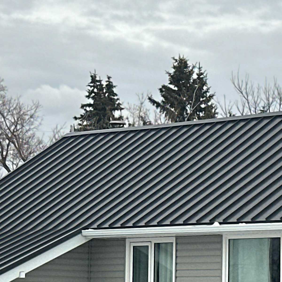 metal-roof-house Standing seam roof installed by KTM Roofing in North Atlanta.