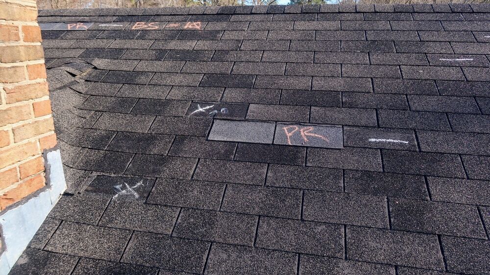 Residential roof inspection for an insurance claim due to storm damage in Atlanta, GA.